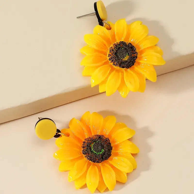 Miniatura: Aretes grandes en forma de girasol
