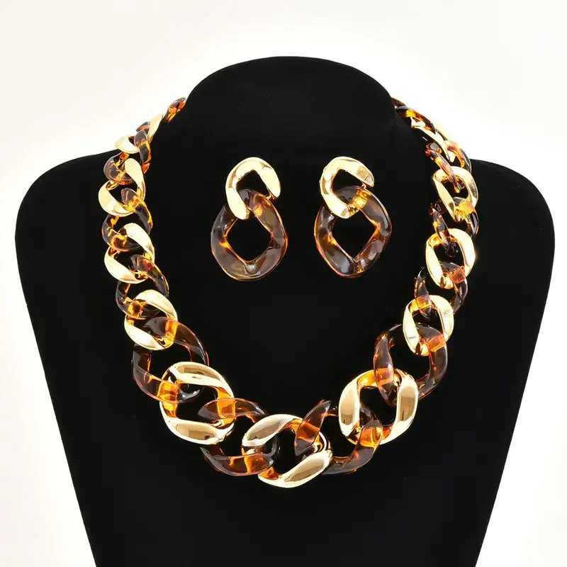 Conjunto aretes y collar acrílico marrón dorado