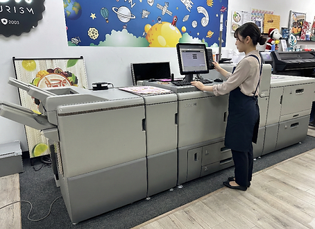 Professional printing and production equipment inside the Sunny Graphics workshop