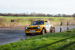 Yellow Toyota Starlet rally car cornering on the Seaton stage, East Riding Stages Rally 2026.