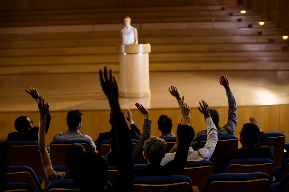 female-business-executive-giving-speech_107420-63794.webp