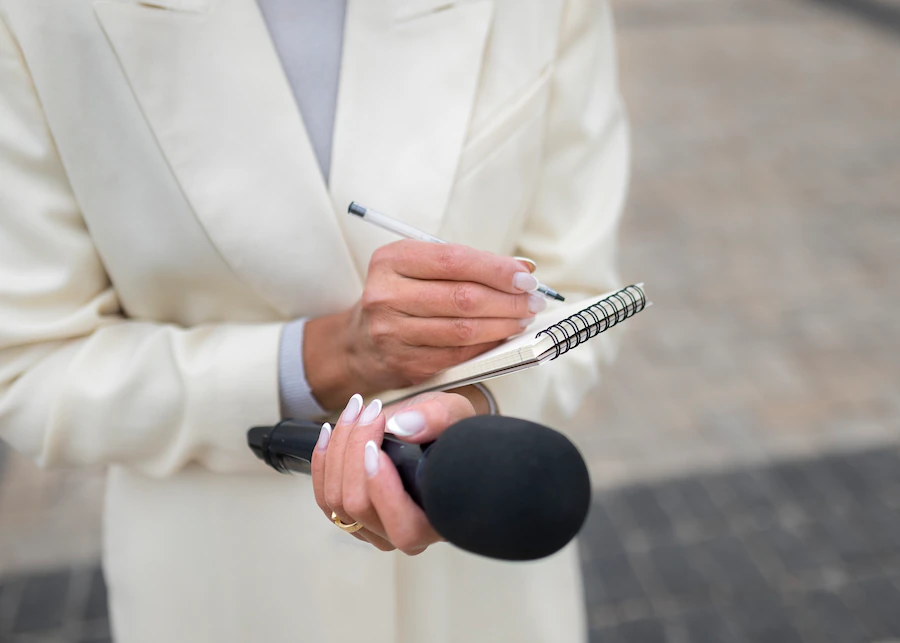 close-up-reporter-preparing-interview_23-2149183587.webp