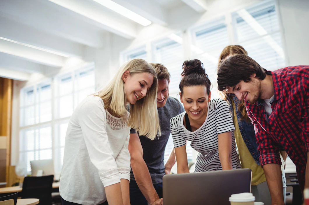 group-business-executives-using-laptop-their-desk_1170-2010.webp