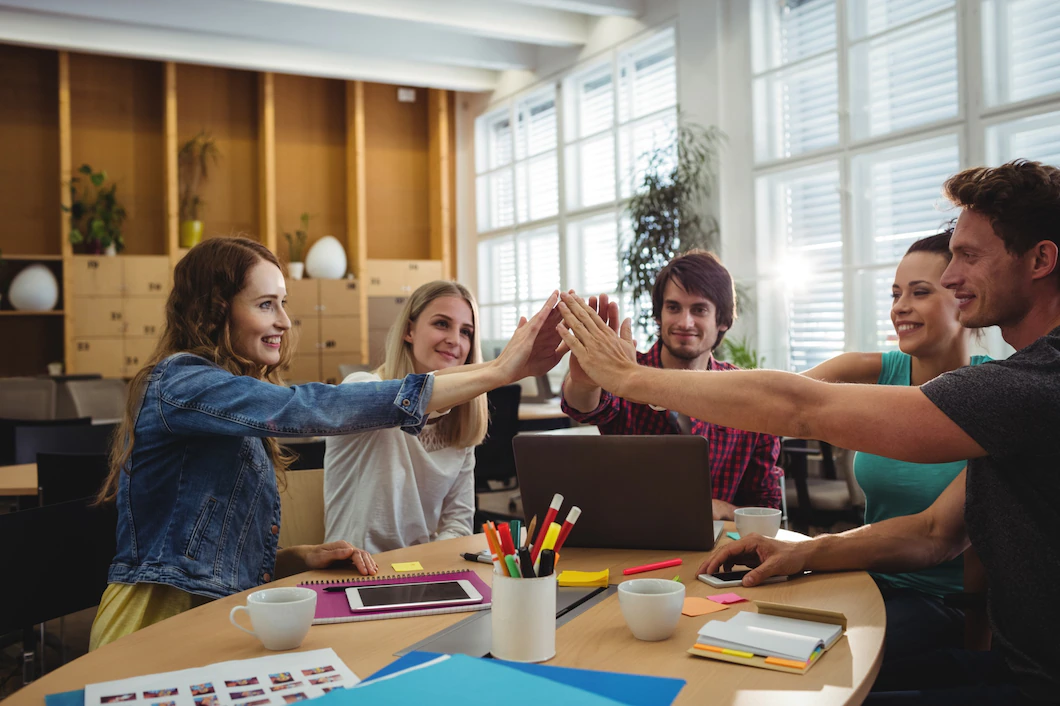creative-business-team-putting-hands-together_1170-1712.webp