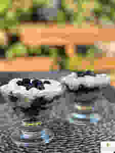Blueberries and mascarpone cream layered in a glass
