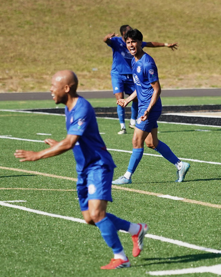 Jermaine Hue and Martin Saucedo celebrate after a Revolution goal