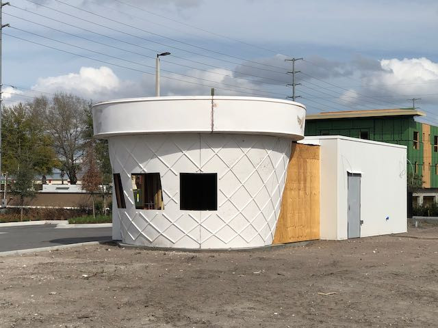 a white unpainted unfinished Twistee Treat building under construction surrounded by dirt in the SODO south downtown district of Orlando