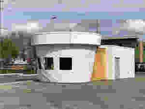 a white unpainted unfinished Twistee Treat building under construction surrounded by dirt in the SODO south downtown district of Orlando