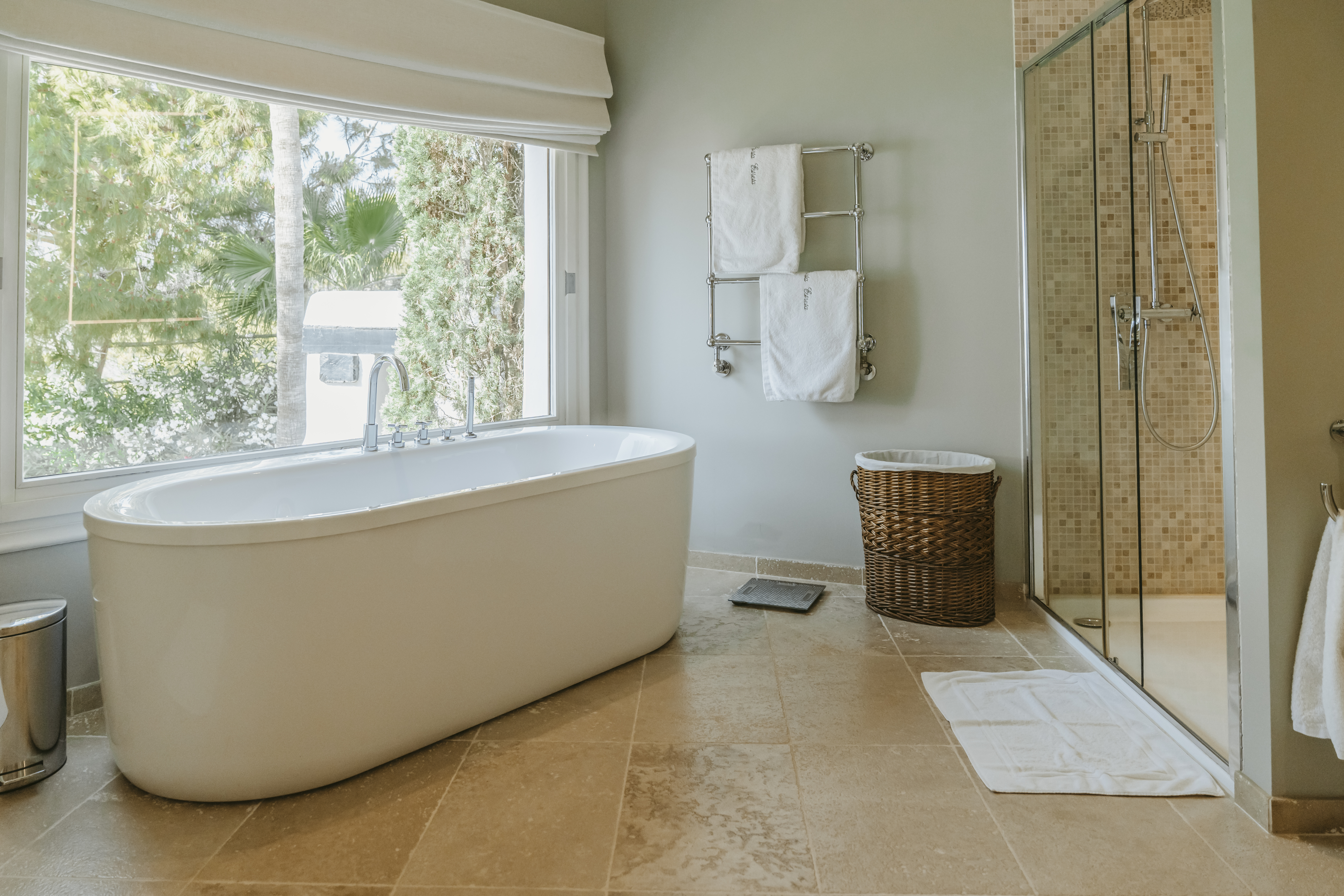 DSC07216Spacious luxury villa bathroom featuring a freestanding soaking tub, walk-in shower, and large window views..jpg