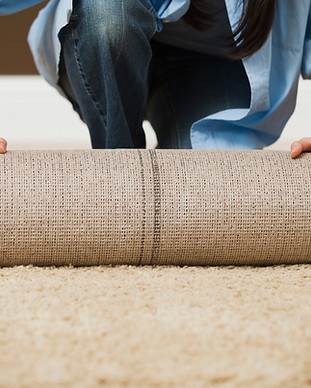 Woman Rolling Carpet