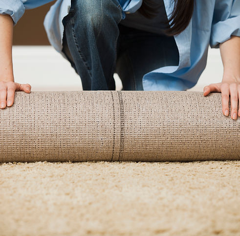 Woman Rolling Carpet