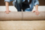 Woman Rolling Carpet