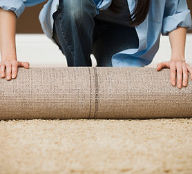 Woman Rolling Carpet