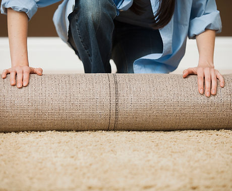 Woman Rolling Carpet