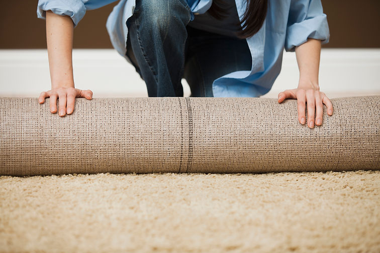 Woman Rolling Carpet