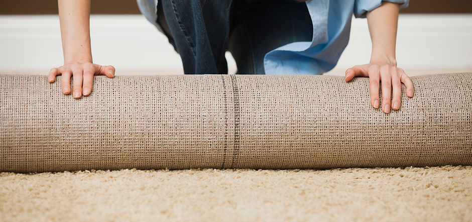Woman Rolling Carpet