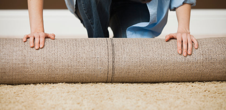 Woman Rolling Carpet