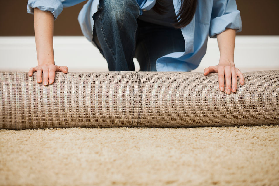 Woman Rolling Carpet