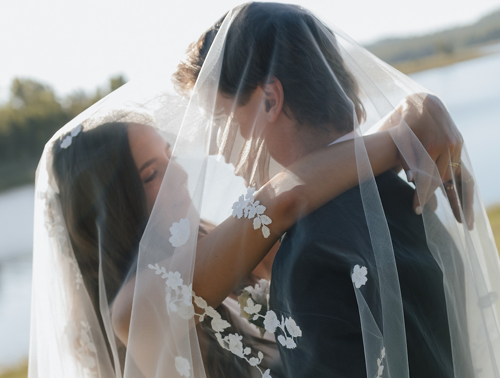 TLC Celebrant newlyweds pictured under brides veil after their romantic wedding ceremony in Queensland