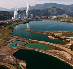 aerial-shot-landscape-surrounded-by-mountains-lakes-with-industrial-disaster.jpg
