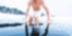 Athlete performing cold water plunge for contrast therapy.