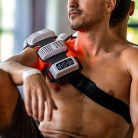 Athlete using red light therapy for muscle recovery.