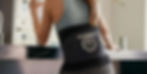 Athlete applying cold therapy with brace on back.