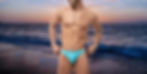 Man wearing thong swimsuit at the beach.
