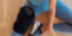 Athlete using a heated knee sleeve for muscle recovery.