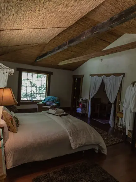 A side view of the bedroom, showcasing the bed and room itself.