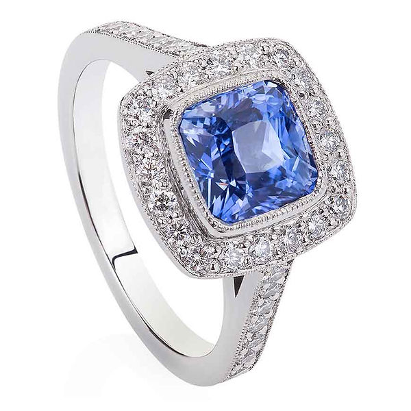 Cushion cut sapphire ring (2.19cts) with milgrain diamond set surround and band.