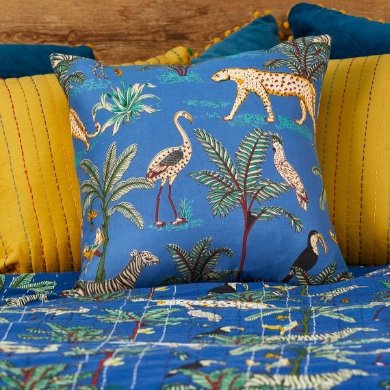 Thumbnail: Hand printed cotton Jungle Print Cushion Cover featuring colourful tropical wonderland of plants, exotic birds and big  cats.