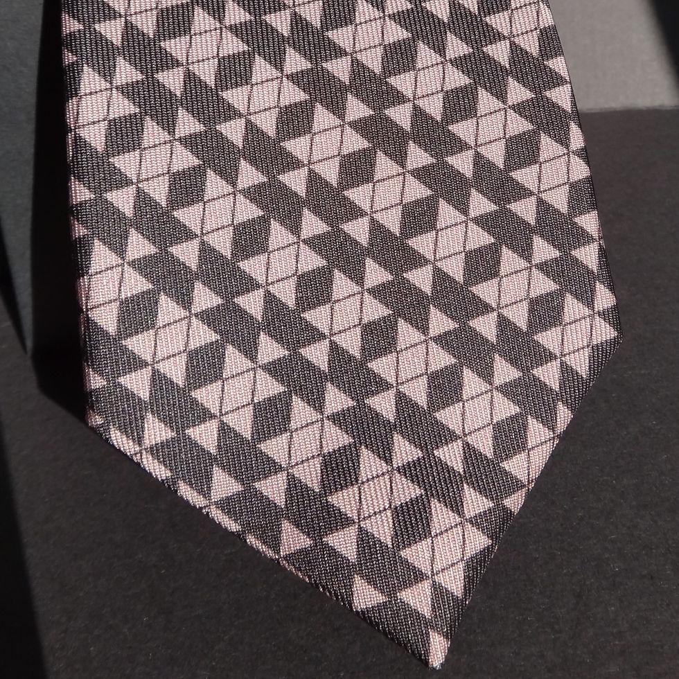 Thumbnail: Pure silk tie with a Bhutanese motif geometric repeat pattern in dark grey and pale grey colours.