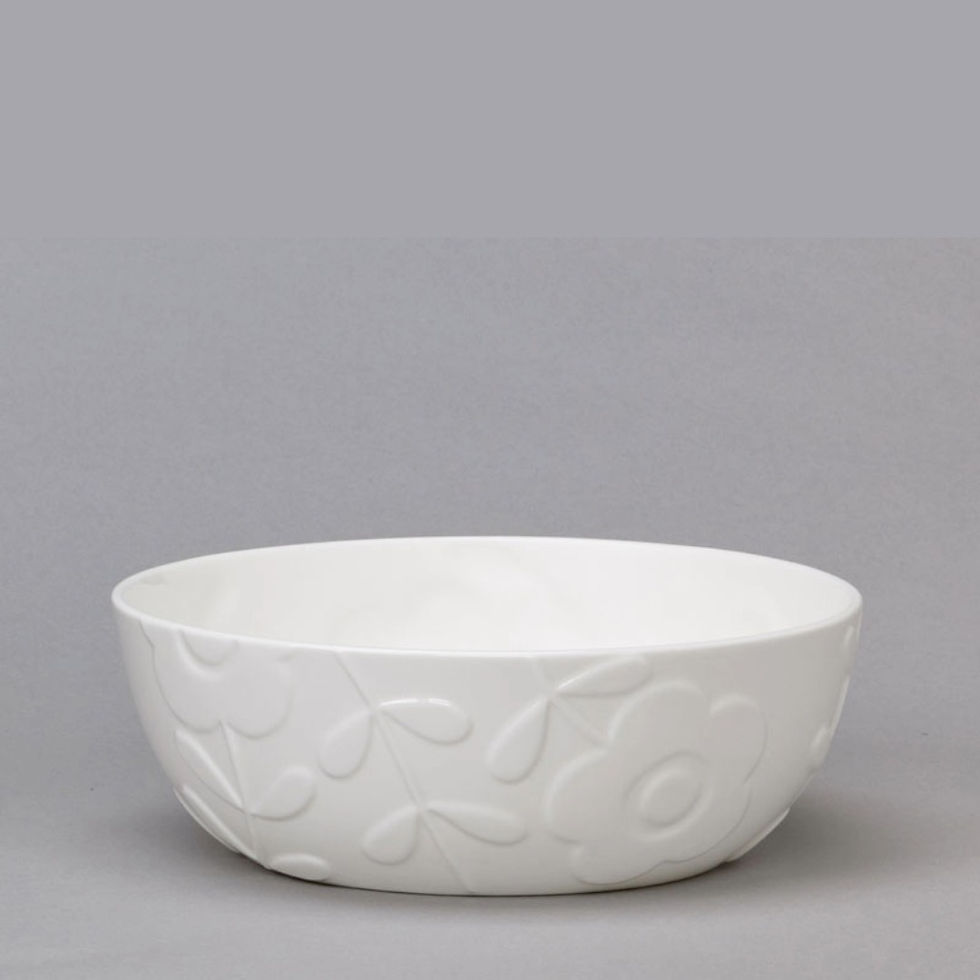 White bone China large everyday bowl  with raised 3D patterns featuring mid-century style floral motifs.