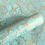 Thumbnail: Recycled wrapping paper featuring large intertwining floral motifs and intricate detailing in gold against a turquoise base.