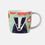 Thumbnail: Folkland Badger Mug with a colourful design featuring a black and white badger, apples and pears on a light sage base.