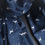 Thumbnail: Cotton Dog Print Scarf in Navy Blue featuring a silhouette of repeat dogs against a navy blue background.