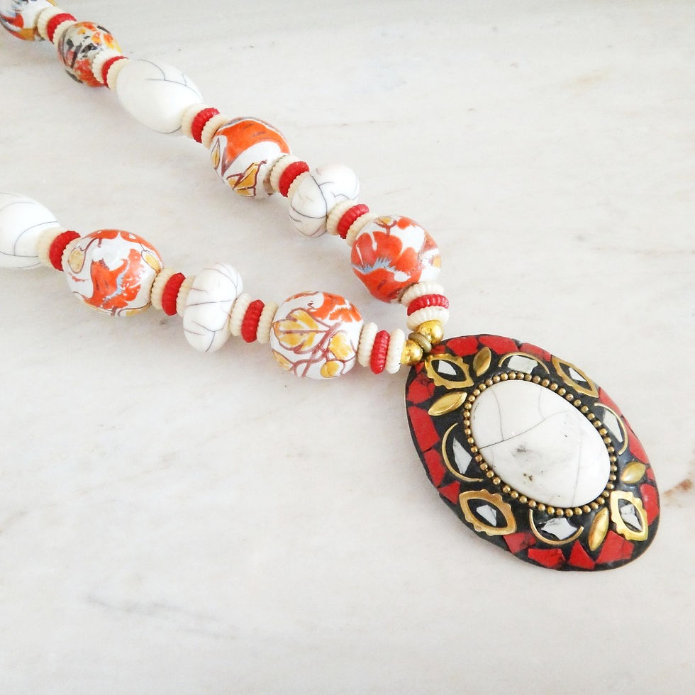 Thumbnail: Handmade Chunky Pendant Necklace - White features hand-painted red and white beads, and an oval pendant with a  large stone.
