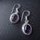 Thumbnail: Handcrafted Oval Crystal Drop Earrings with purple gemstone.