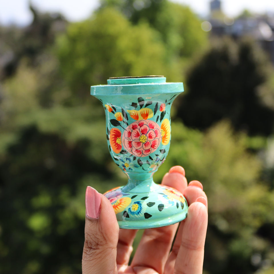 Thumbnail: Glazed turquoise Hand Painted Kashmiri Candlestick featuring intricate and colourful flower petals, and delicate foliage.