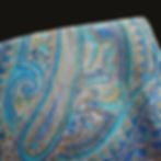 Indian paisley long silk scarf, beautifully adorned with bold blue paisley motifs embroidered in silk thread on a grey base.