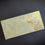Thumbnail: Handmade floral envelopes feature gold-embossed botanicals along the left edge, complemented by delicate greeen blooms base