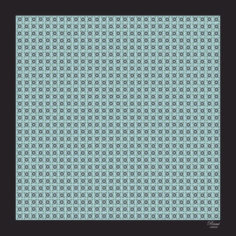 Turquoise floral motif silk pocket square features a vibrant repeat floral pattern against a rich turquoise base.