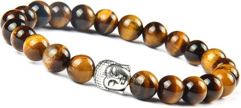 Close-up of beaded bracelet with tiger eye stones and Buddha head ornament.
