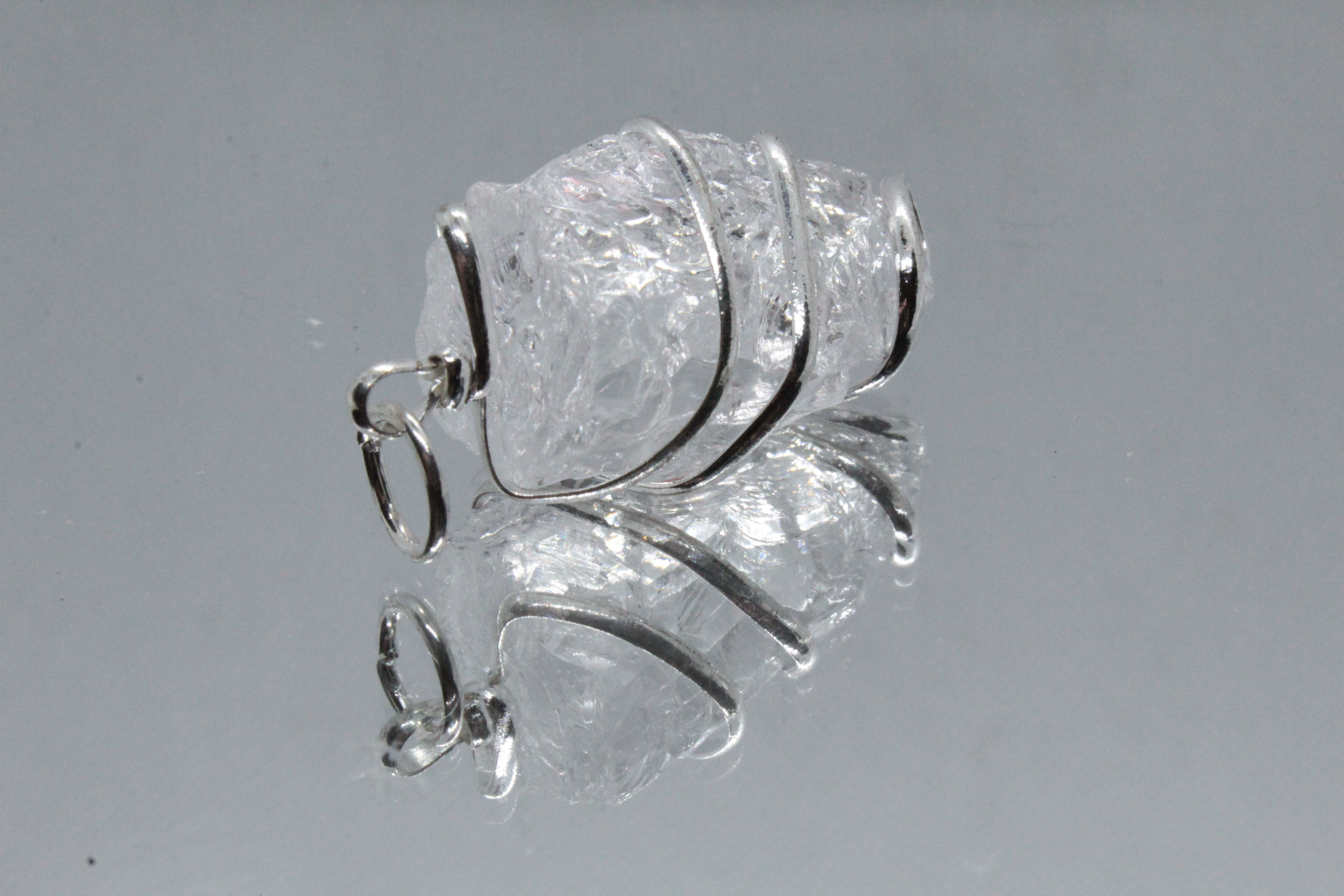 Pendentif Cristal de Roche brut cerclé
