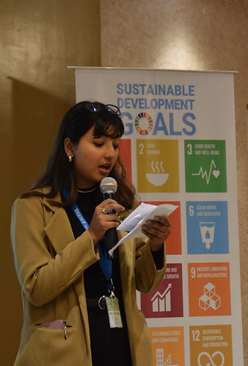 Beauty speaking at an event