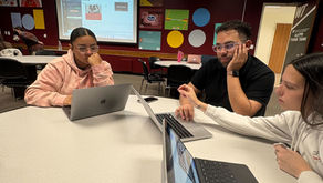 Ivana Garcia, Alexis Navarrete, and Rebecca Hayes work on the Sybil B. Harrington College of Fine Arts and Humanities social media content