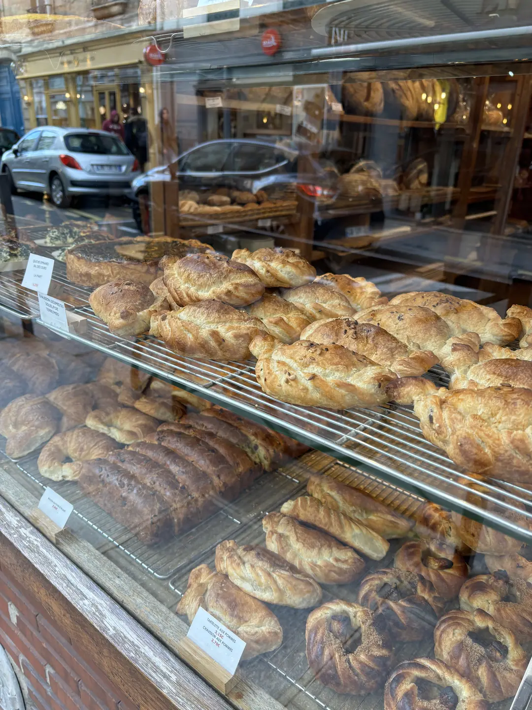 Poilâne bakery window with traditional French pastries in Saint-Germain, Paris