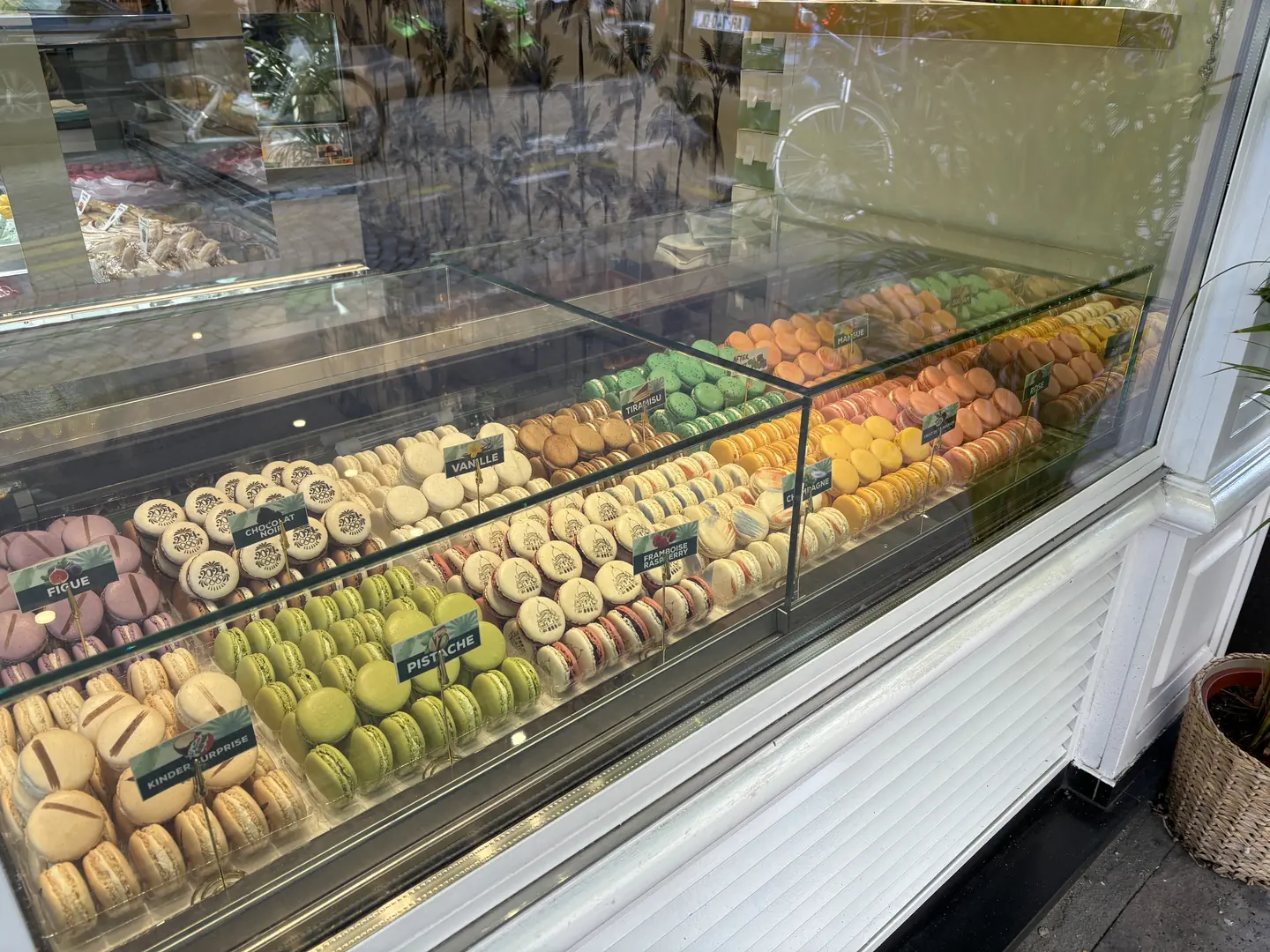 Artisan macaron display at a traditional Montmartre pastry shop