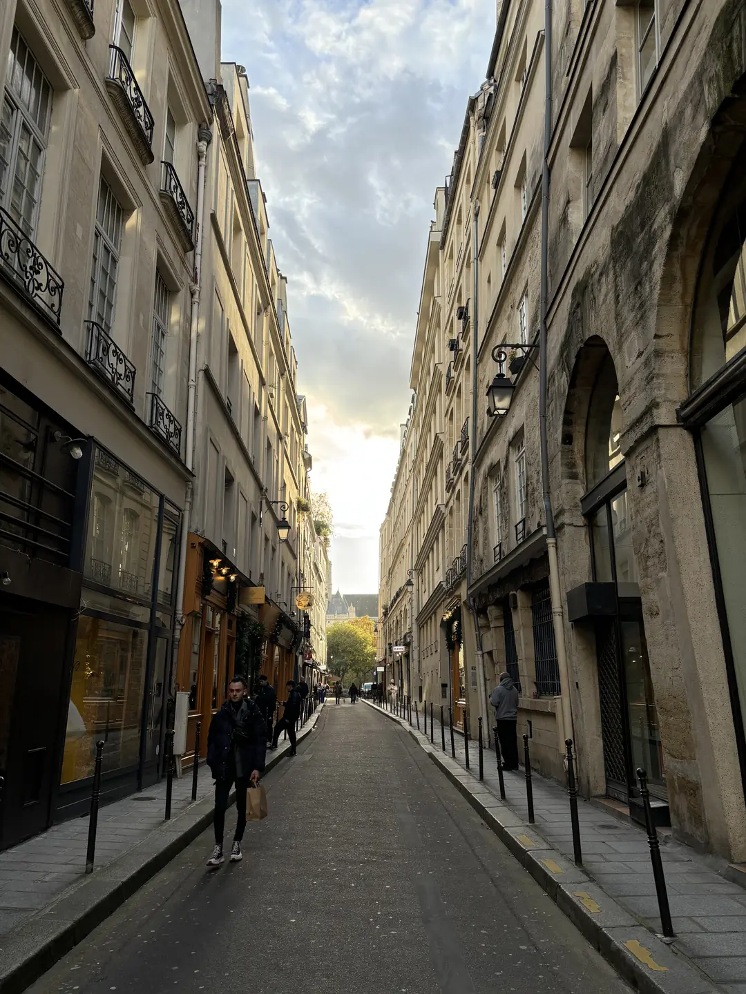 Charming historic street in the Marais district of Paris at sunset